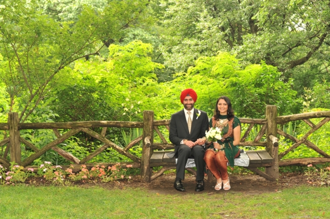 Newlyweds sitting on wooden bench just west of the Castle by: Steve Worth