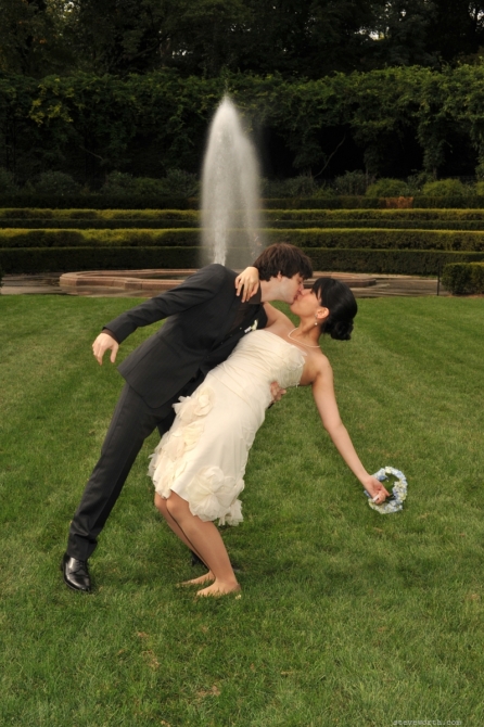 Bride being dipped in Italianate Garden by: Steve Worth